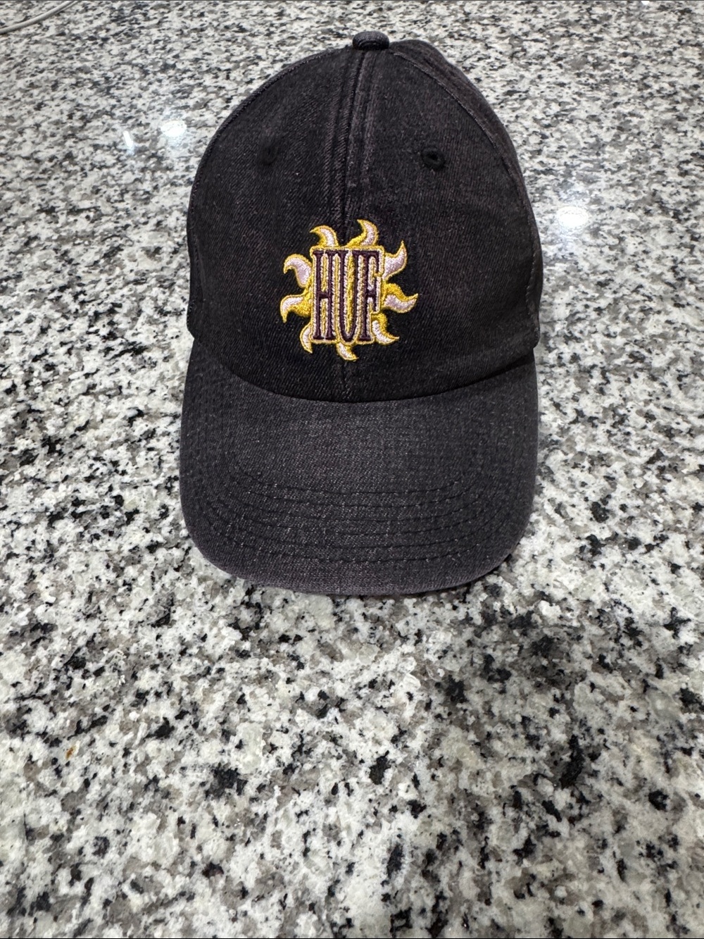 HUF Black Cap with Yellow Sun Emblem